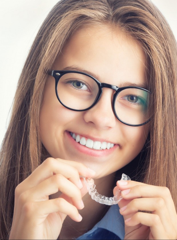 Young Girl With Dental Invisible Braces.